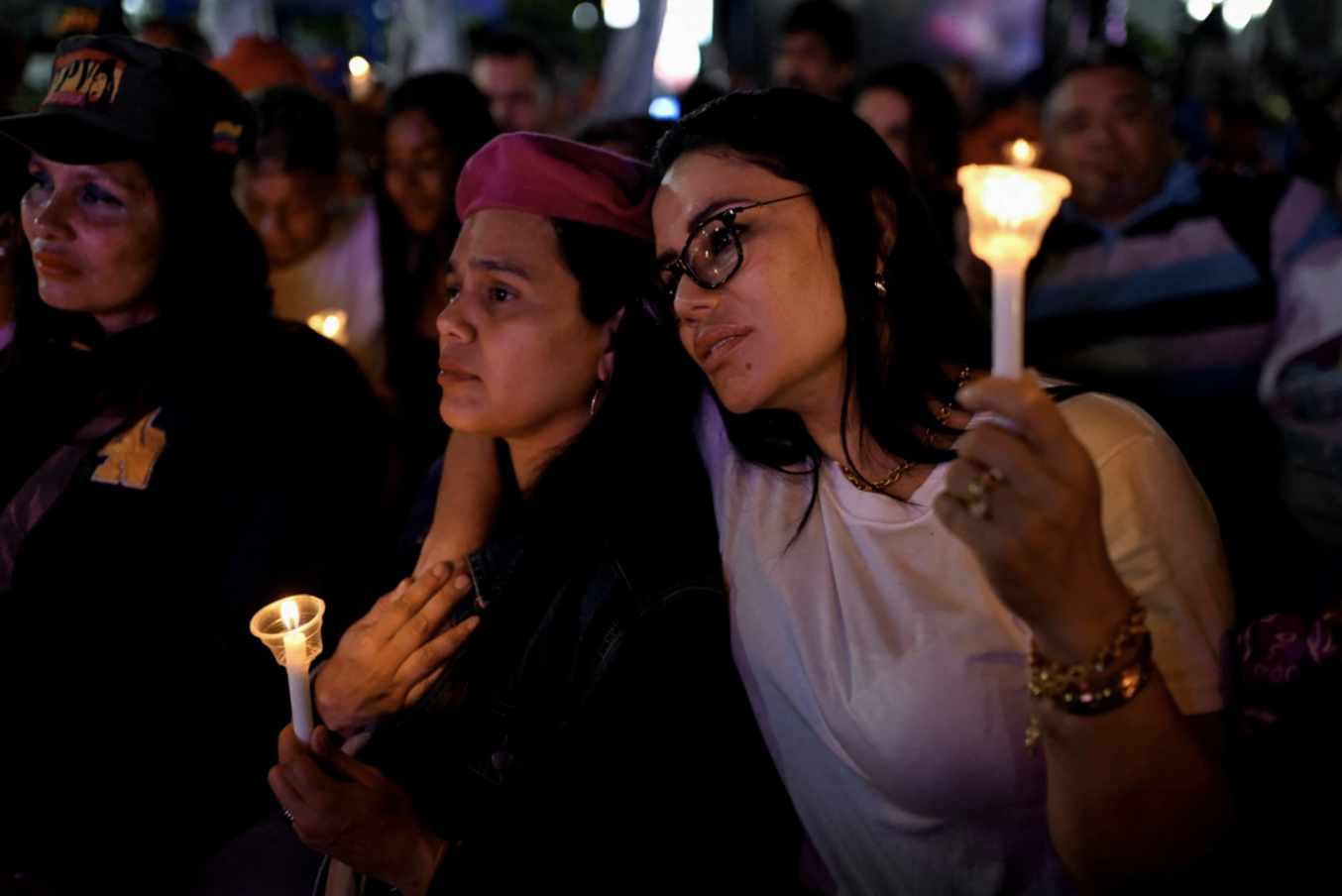 Women hold candles during a vigil to honor those killed on January 3 during the U.S. operation to capture Venezuela’s President Nicolas Maduro and his wife Cilia Flores, at Bolivar Square in Caracas, Venezuela, January 22, 2026. Image: CFR