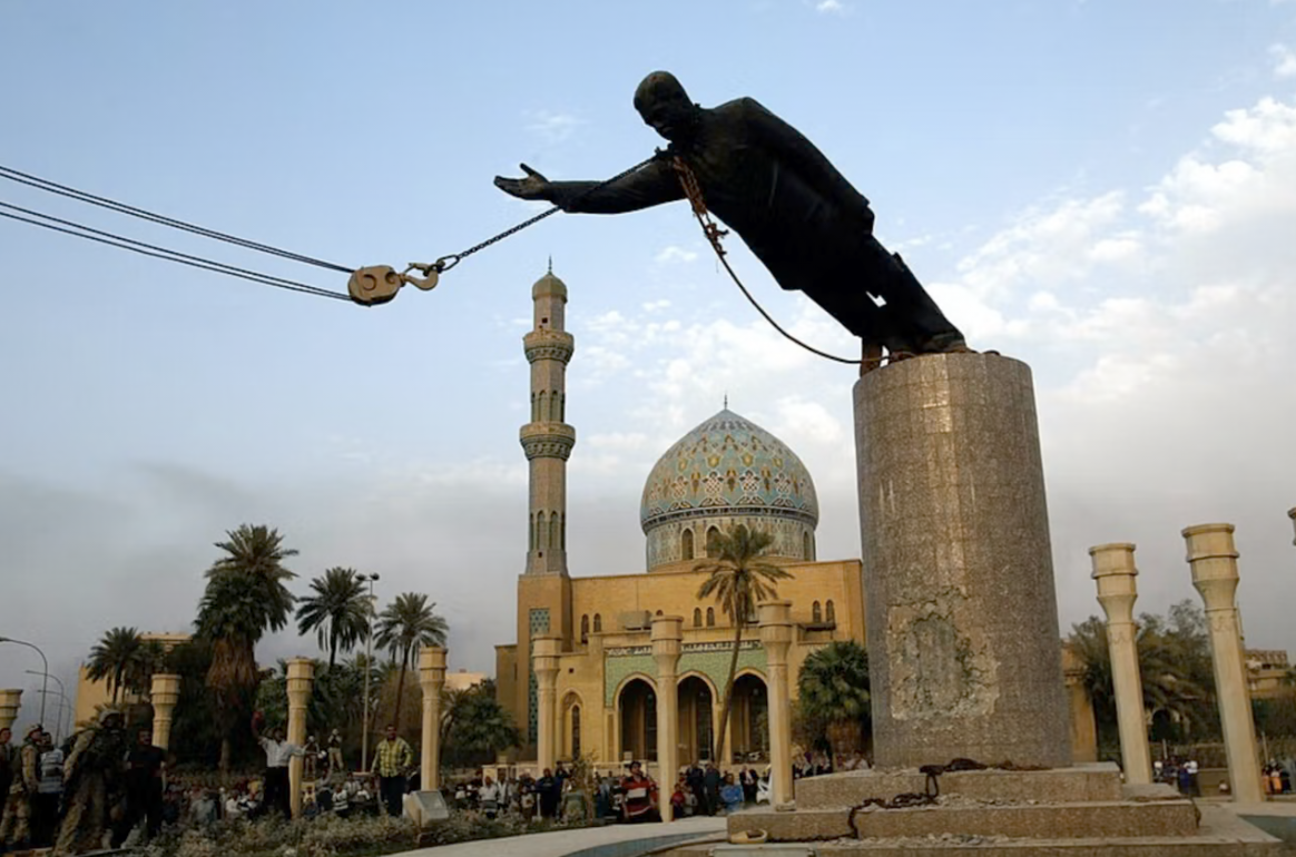 Statue of Saddam Hussein being toppled in Firdos Square in Baghdad after U.S. forces took the city, April 9, 2003.