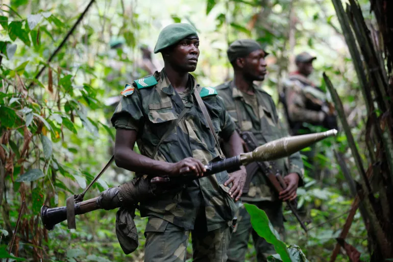 DRC soldiers patrol against ADF rebels near Beni in North Kivu province, which borders Uganda and Rwanda