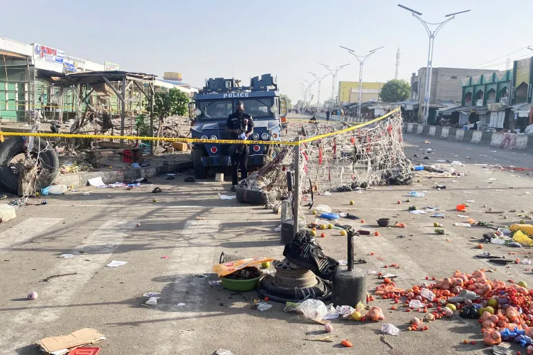 A Nigerian police truck stands at the deserted Maiduguri Monday Market the morning after multiple explosions struck the northeastern city of Maiduguri, Borno State on March 17, 2026