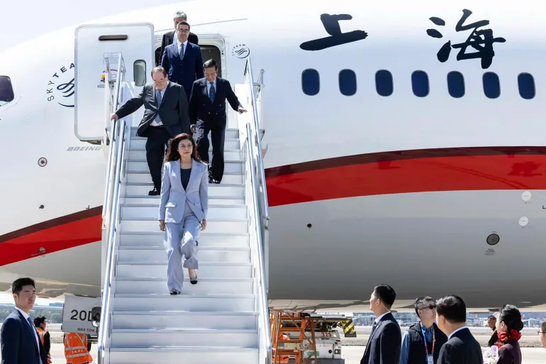 KMT leader Cheng Li-wun, front on stairs, arrives in Shanghai, China, April 7, 2026