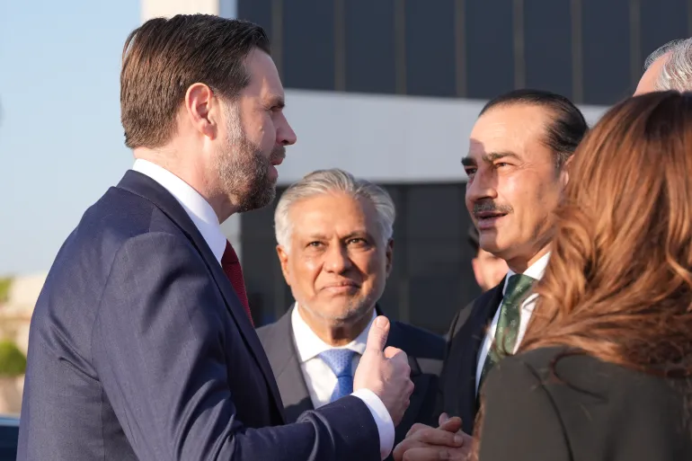 US Vice President JD Vance, left, talks to Pakistan's Chief of Defence Forces Asim Munir, right, and Pakistani Deputy Prime Minister and Foreign Minister Ishaq Dar, centre, before boarding Air Force Two after attending talks on ending the US-Israel war on Iran, in Islamabad, Pakistan