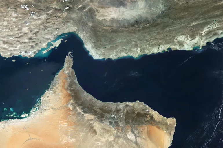 A satellite view of the Strait of Hormuz, a critical chokepoint for global energy supplies that connects the Gulf to the Gulf of Oman