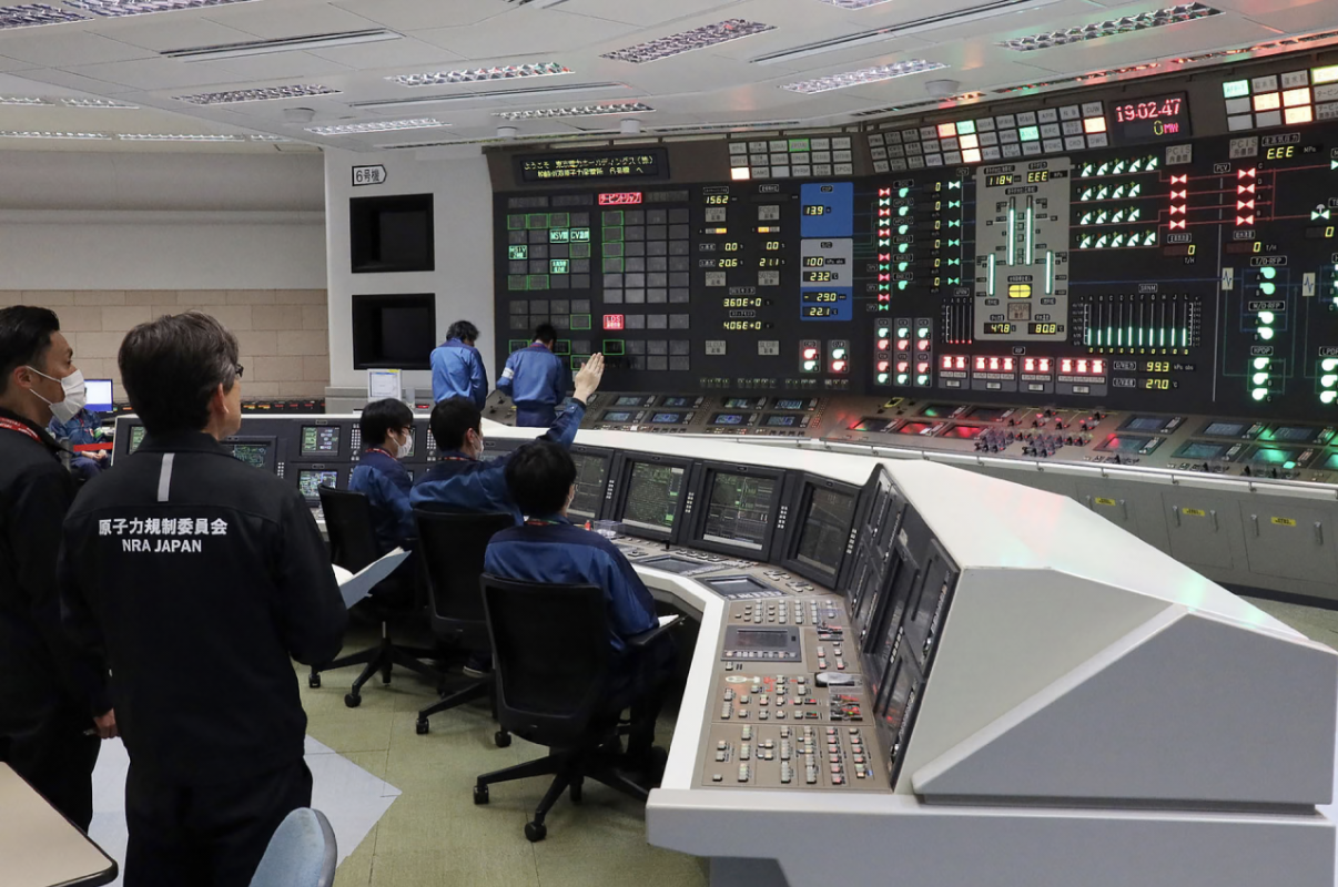 Workers sit in front of a nuclear power plant central control room for the Tokyo Electric Power Company Kashiwazaki-Kariwa on January 21, 2026