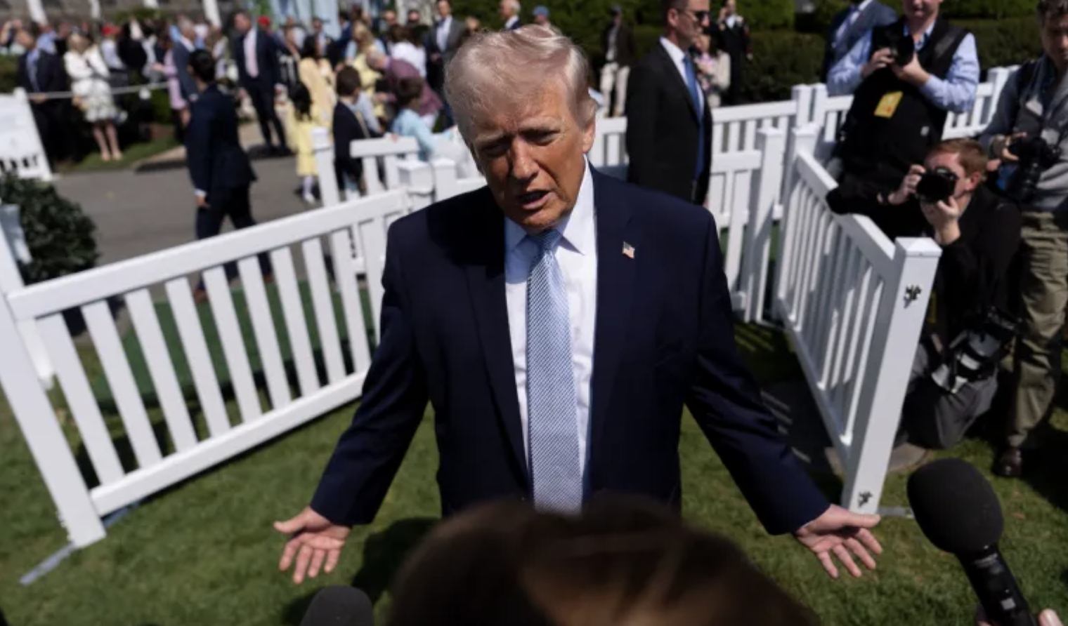 US President Donald Trump speaks with reporters at the White House on April 6