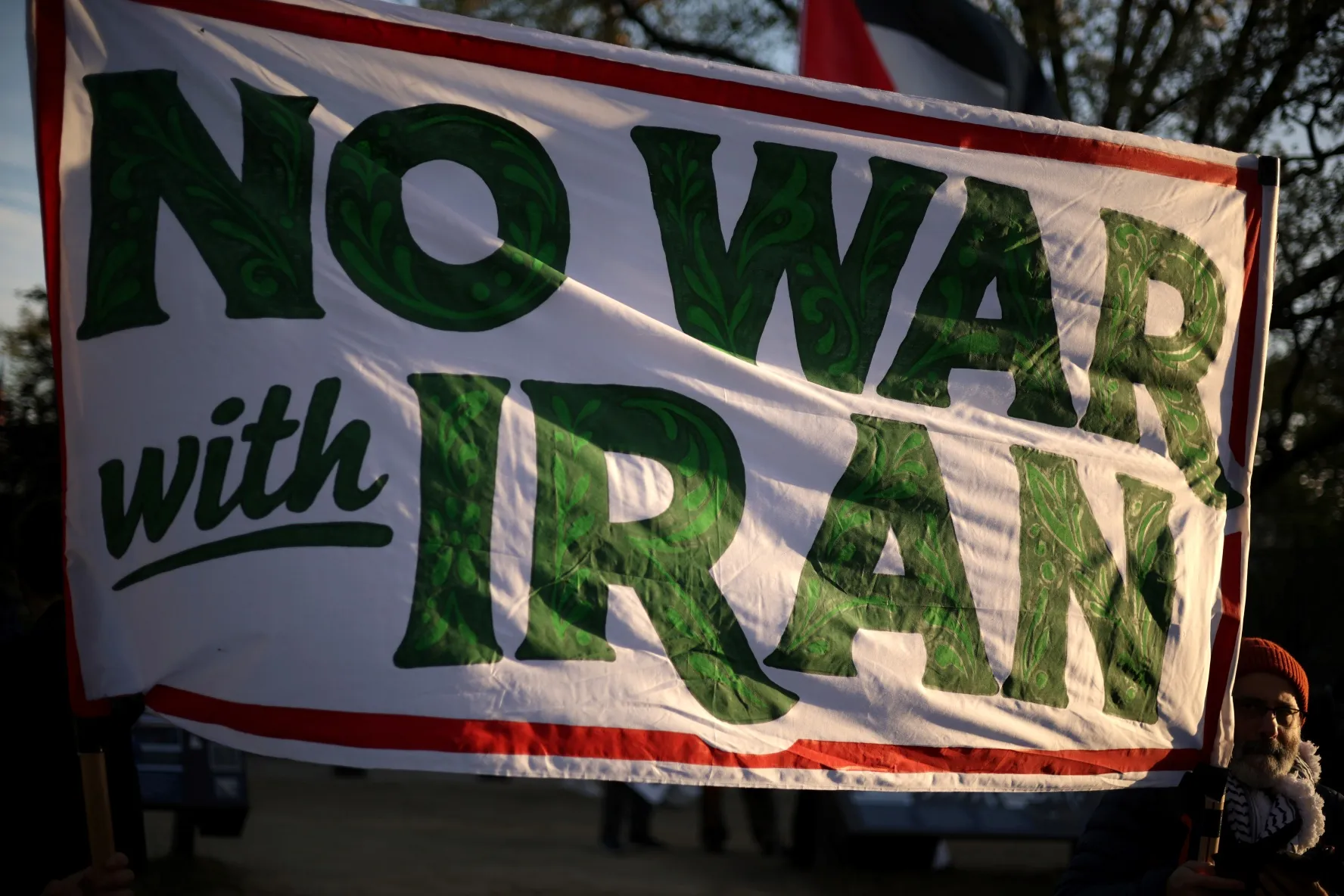 An anti-war demonstrator participates in a protest against the war in Iran near the White House on April 8, 2026, in Washington, DC.