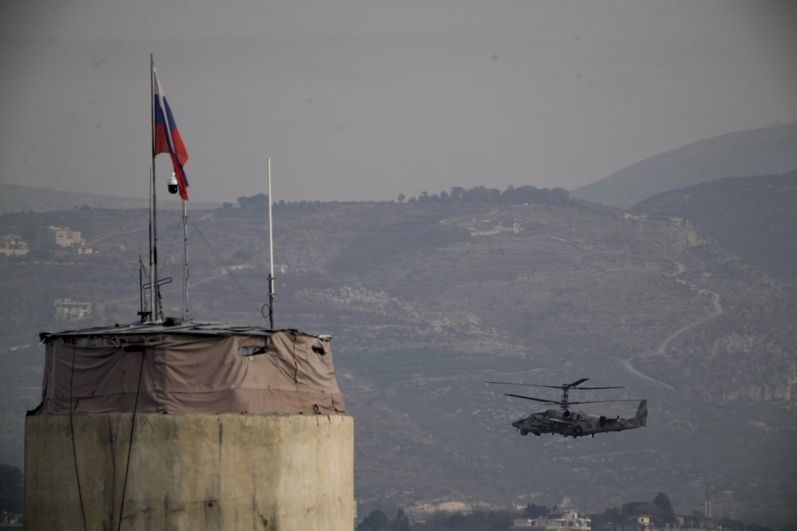 A Russian helicopter flying over an air base Moscow maintains in Syria in 2024.