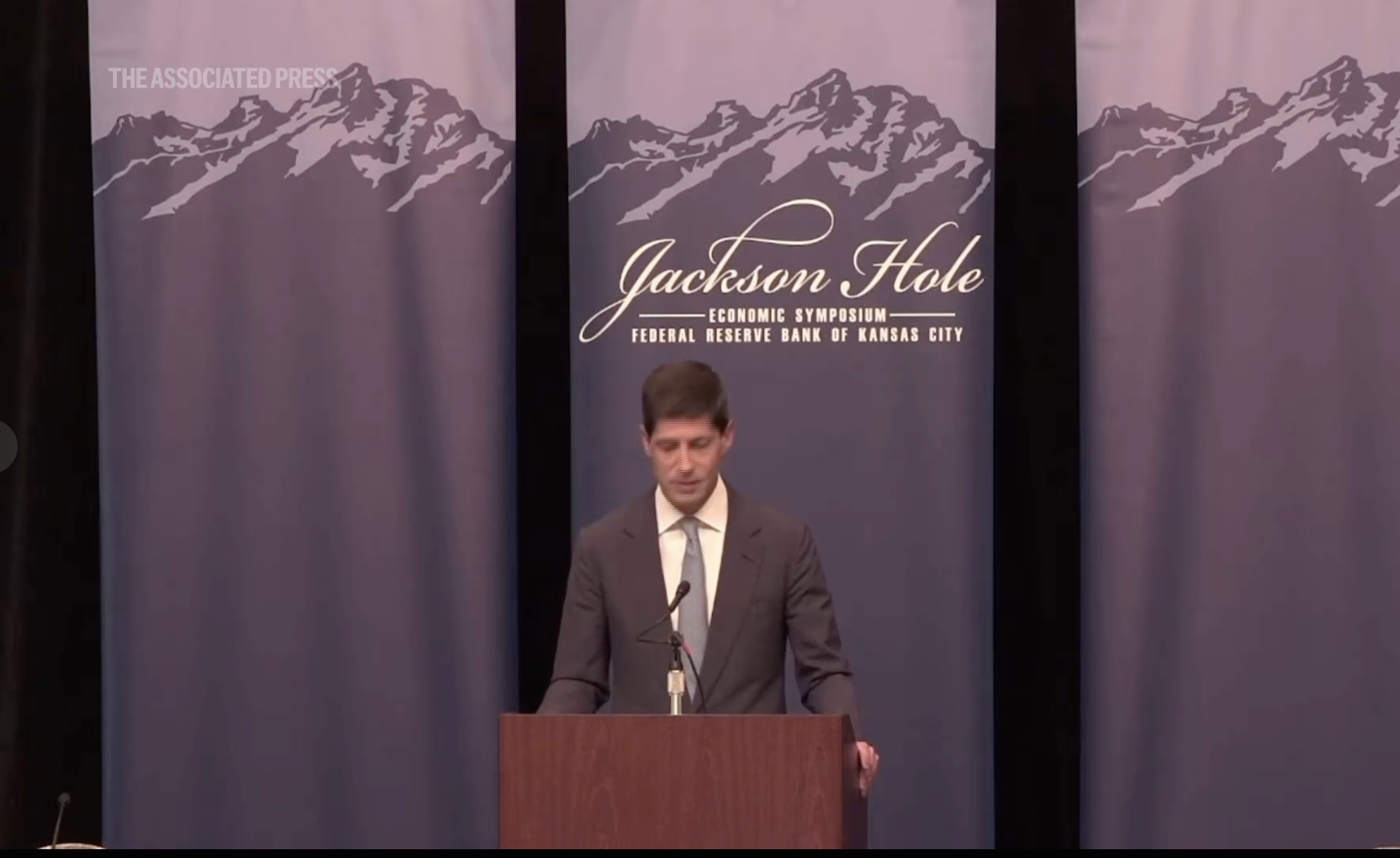 Federal Reserve Chair Kevin Warsh speaking at Jackson Hole about interest rates and US inflation.