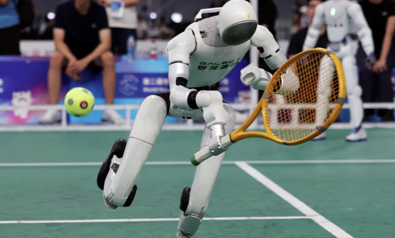 Chinese robots tackle tennis, smash track records at World Humanoid Robot Games
