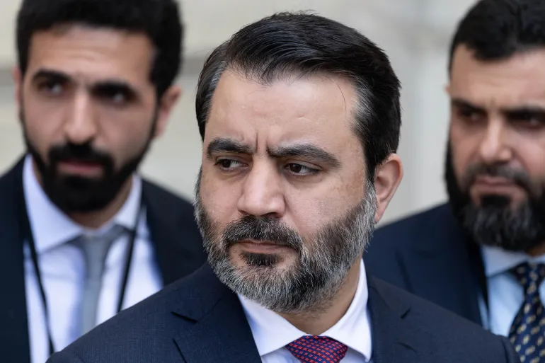 Syria's Foreign Minister Asaad al-Shaibani waits before attending a meeting at the Elysee Palace on May 7, 2025